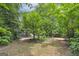 Wooded backyard with a small garden and a tranquil atmosphere at 731 Airline Rd, Mcdonough, GA 30252