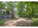 Spacious backyard with mature trees and a stone border at 731 Airline Rd, Mcdonough, GA 30252