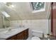 Bathroom with vanity, toilet, and skylight at 731 Airline Rd, Mcdonough, GA 30252