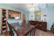 Dining room with wood table and access to kitchen at 731 Airline Rd, Mcdonough, GA 30252