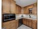 Kitchen boasts ample wood cabinetry and a corner sink at 731 Airline Rd, Mcdonough, GA 30252
