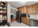 Modern kitchen with stainless steel appliances and wood cabinets at 731 Airline Rd, Mcdonough, GA 30252