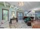 Spacious living room with hardwood floors, a piano, and access to a deck at 731 Airline Rd, Mcdonough, GA 30252