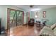 Bright living room with hardwood floors and sliding glass doors to deck at 731 Airline Rd, Mcdonough, GA 30252