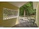 Small patio with table and chairs, adjacent to woods at 731 Airline Rd, Mcdonough, GA 30252
