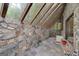 Sunroom with stone walls, skylights, and tile flooring at 731 Airline Rd, Mcdonough, GA 30252