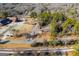 Aerial view of property with wooded area nearby at 653 Temple St, Lithia Springs, GA 30122