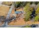Aerial view of ranch house and surrounding land at 653 Temple St, Lithia Springs, GA 30122