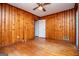 Bedroom with wood paneled walls and hardwood floors at 653 Temple St, Lithia Springs, GA 30122