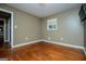 Bright bedroom with hardwood floors and neutral walls at 653 Temple St, Lithia Springs, GA 30122