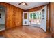 Bright dining room with wood walls and access to a deck at 653 Temple St, Lithia Springs, GA 30122