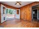 Bright dining room with wood walls and access to a deck at 653 Temple St, Lithia Springs, GA 30122