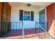 Front porch with metal railing and window at 653 Temple St, Lithia Springs, GA 30122