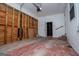 Unfinished garage interior with an automatic door opener at 653 Temple St, Lithia Springs, GA 30122