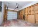 Unfinished garage interior with automatic garage door at 653 Temple St, Lithia Springs, GA 30122