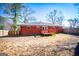 Brick home exterior showcasing a deck and backyard at 653 Temple St, Lithia Springs, GA 30122