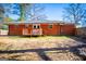Brick house exterior with a wooden deck and yard at 653 Temple St, Lithia Springs, GA 30122