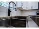 Modern farmhouse kitchen with a farmhouse sink at 653 Temple St, Lithia Springs, GA 30122