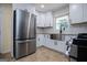 Modern kitchen with stainless steel appliances at 653 Temple St, Lithia Springs, GA 30122