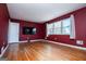 Spacious living room with hardwood floors and large windows at 653 Temple St, Lithia Springs, GA 30122