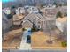 Aerial view of home showcasing a manicured lawn, mature trees, and a private driveway at 301 Dunstans Pass, Marietta, GA 30066