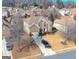 Wide aerial of property showcasing mature trees, a private driveway, and manicured lawn at 301 Dunstans Pass, Marietta, GA 30066