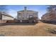 Wide backyard featuring a deck with stairs, privacy fence, and spacious grassy lawn at 301 Dunstans Pass, Marietta, GA 30066