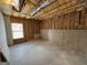 Unfinished basement showcasing exposed insulation and concrete walls, ready for customization at 301 Dunstans Pass, Marietta, GA 30066