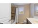 Bathroom with a shower-tub combination, a window, and a vanity with storage at 301 Dunstans Pass, Marietta, GA 30066