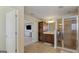 Bright bathroom featuring tile flooring, glass shower, and a vanity with modern fixtures and storage space at 301 Dunstans Pass, Marietta, GA 30066
