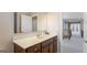 Upstairs bathroom featuring neutral colors, a vanity with storage, and a mirror at 301 Dunstans Pass, Marietta, GA 30066