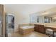 Spacious primary bathroom with soaking tub, dual vanities, and walk-in closet access at 301 Dunstans Pass, Marietta, GA 30066