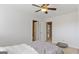 Bedroom with ceiling fan and 2 doorways, one leading to ensuite bathroom at 301 Dunstans Pass, Marietta, GA 30066