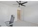 Bright bedroom features a modern ceiling fan, neutral carpet and white walls at 301 Dunstans Pass, Marietta, GA 30066