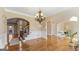 Elegant dining room features hardwood floors, wainscoting, and a decorative chandelier at 301 Dunstans Pass, Marietta, GA 30066