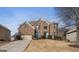 Charming brick home featuring a manicured lawn and attached two-car garage at 301 Dunstans Pass, Marietta, GA 30066