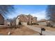 Handsome brick house featuring an attached two-car garage, driveway and manicured landscaping at 301 Dunstans Pass, Marietta, GA 30066