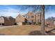 Beautiful brick home with a well-maintained lawn, mature trees, and an attached two-car garage at 301 Dunstans Pass, Marietta, GA 30066