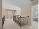 Upstairs hallway with railing and staircase features views to rooms on either side at 301 Dunstans Pass, Marietta, GA 30066