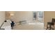 Bright sitting room with carpet floors, large windows, and neutral paint colors at 301 Dunstans Pass, Marietta, GA 30066