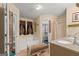 Bathroom with double vanity and a large soaking tub at 5899 Meadow Ln, Rex, GA 30273