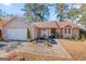 Two car garage and a well maintained lawn at 5899 Meadow Ln, Rex, GA 30273