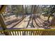 A view from the wooden deck overlooking the wooded backyard and long driveway at 60 Sweet Bay Ln, Carrollton, GA 30116