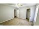 Bedroom featuring neutral carpet, paint, and access to a closet at 60 Sweet Bay Ln, Carrollton, GA 30116