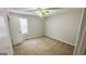 Bedroom with plush carpet and a large window at 60 Sweet Bay Ln, Carrollton, GA 30116