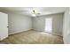 Bedroom with plush carpet, neutral walls, and a glass panel door at 60 Sweet Bay Ln, Carrollton, GA 30116