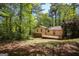 Charming home with a deck surrounded by mature trees, offering a serene outdoor living space at 60 Sweet Bay Ln, Carrollton, GA 30116