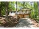 Charming split-level home featuring a stone facade and a welcoming front porch at 60 Sweet Bay Ln, Carrollton, GA 30116