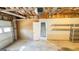 Spacious garage featuring shelving, an entrance to the home and garage door at 60 Sweet Bay Ln, Carrollton, GA 30116