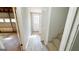 Hallway from the garage to the house with LVP flooring at 60 Sweet Bay Ln, Carrollton, GA 30116